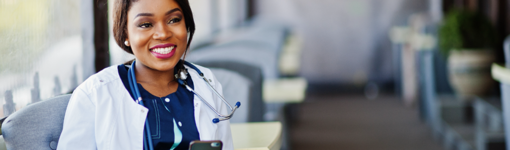 A locum tenens nurse practitioner sitting at a desk