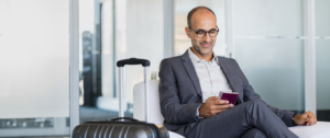 Traveling locum tenens physician holding passport